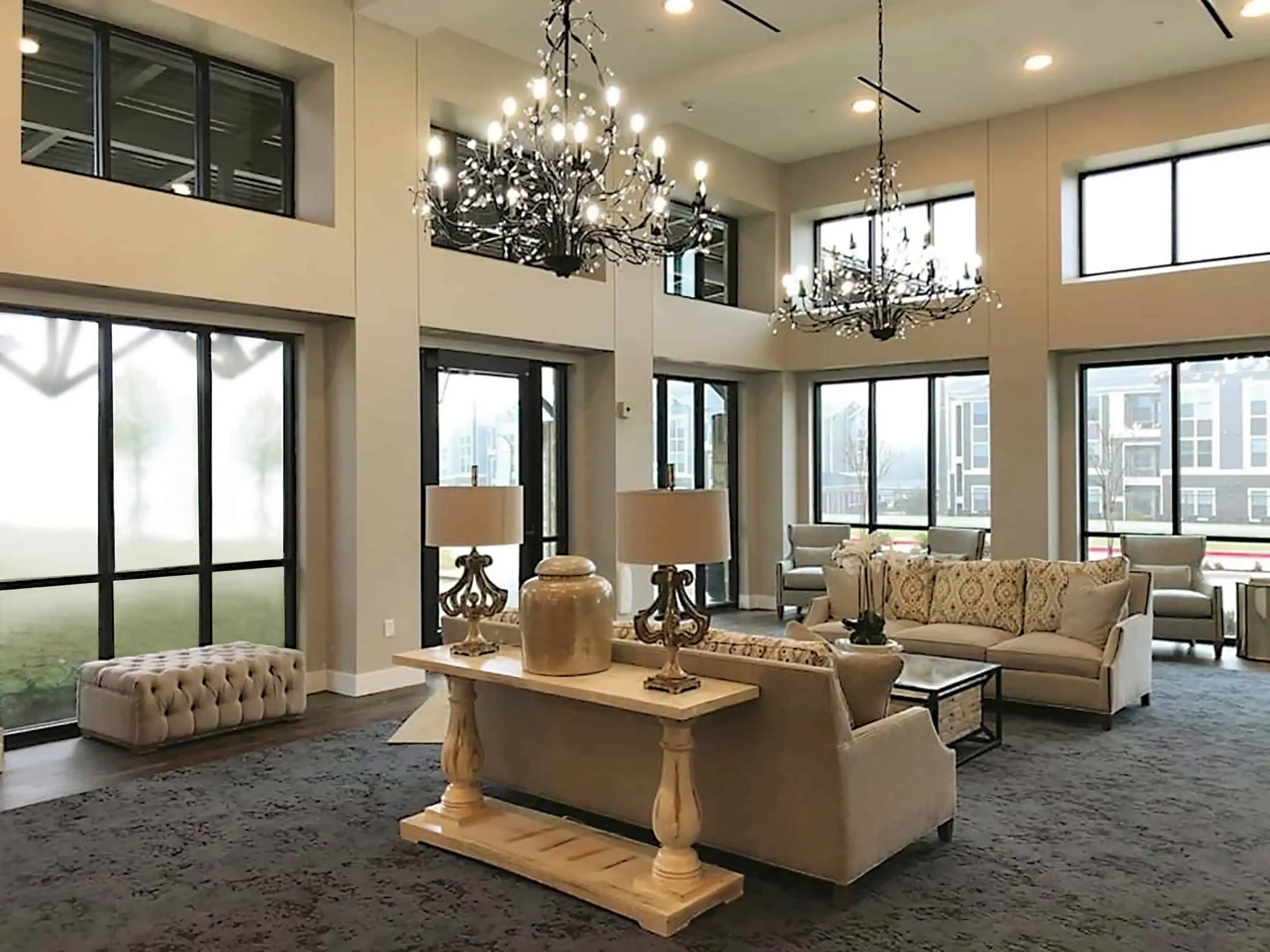 The two-storey lobby, with chandeliers, tall windows and sitting areas