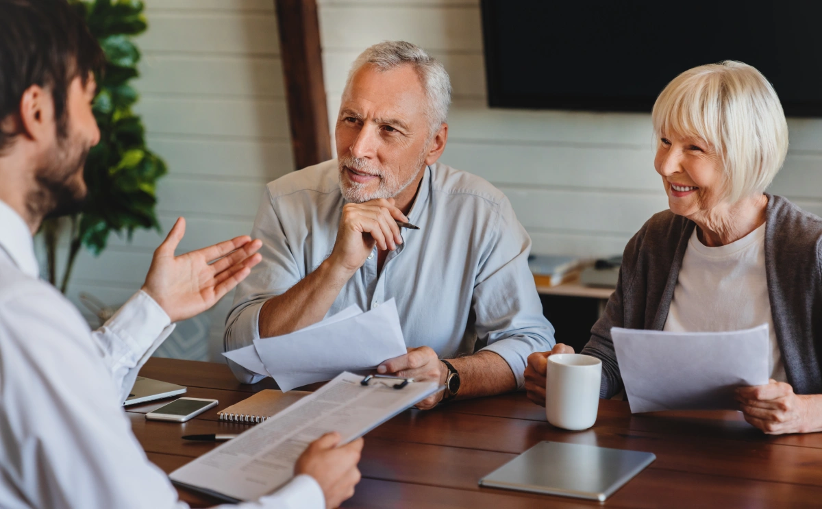A family sitting down with a team member to talk through care